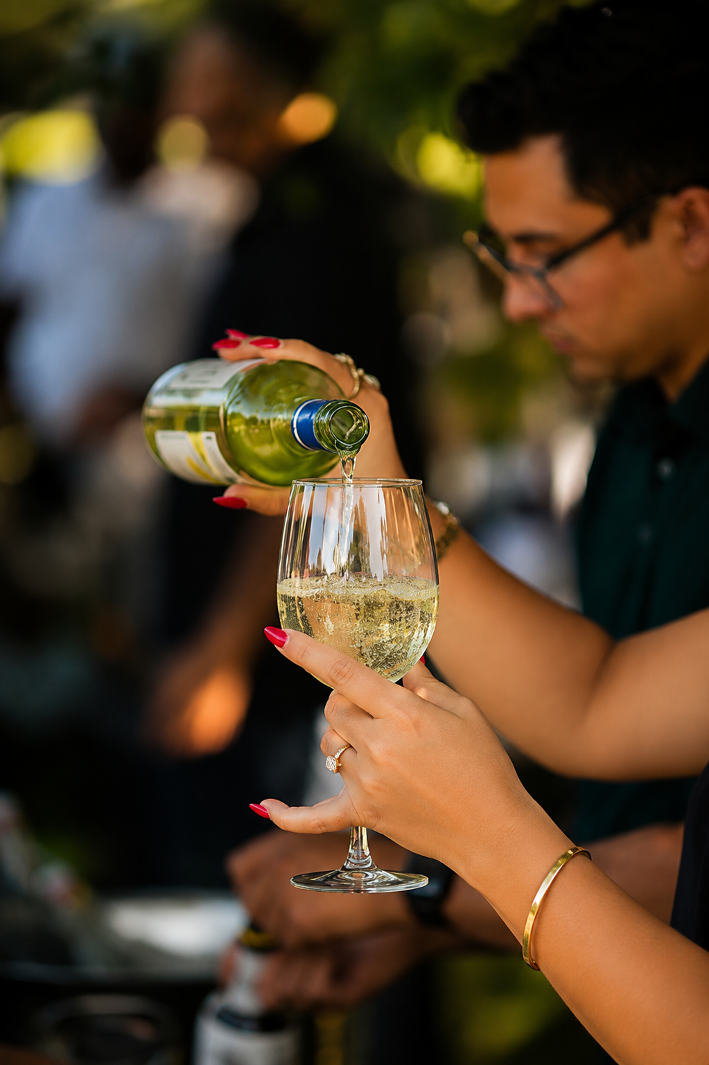 White wine poured for a guest during a gala cocktail hour